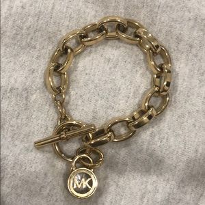 Michael Kors Gold Bracelet with logo charm
